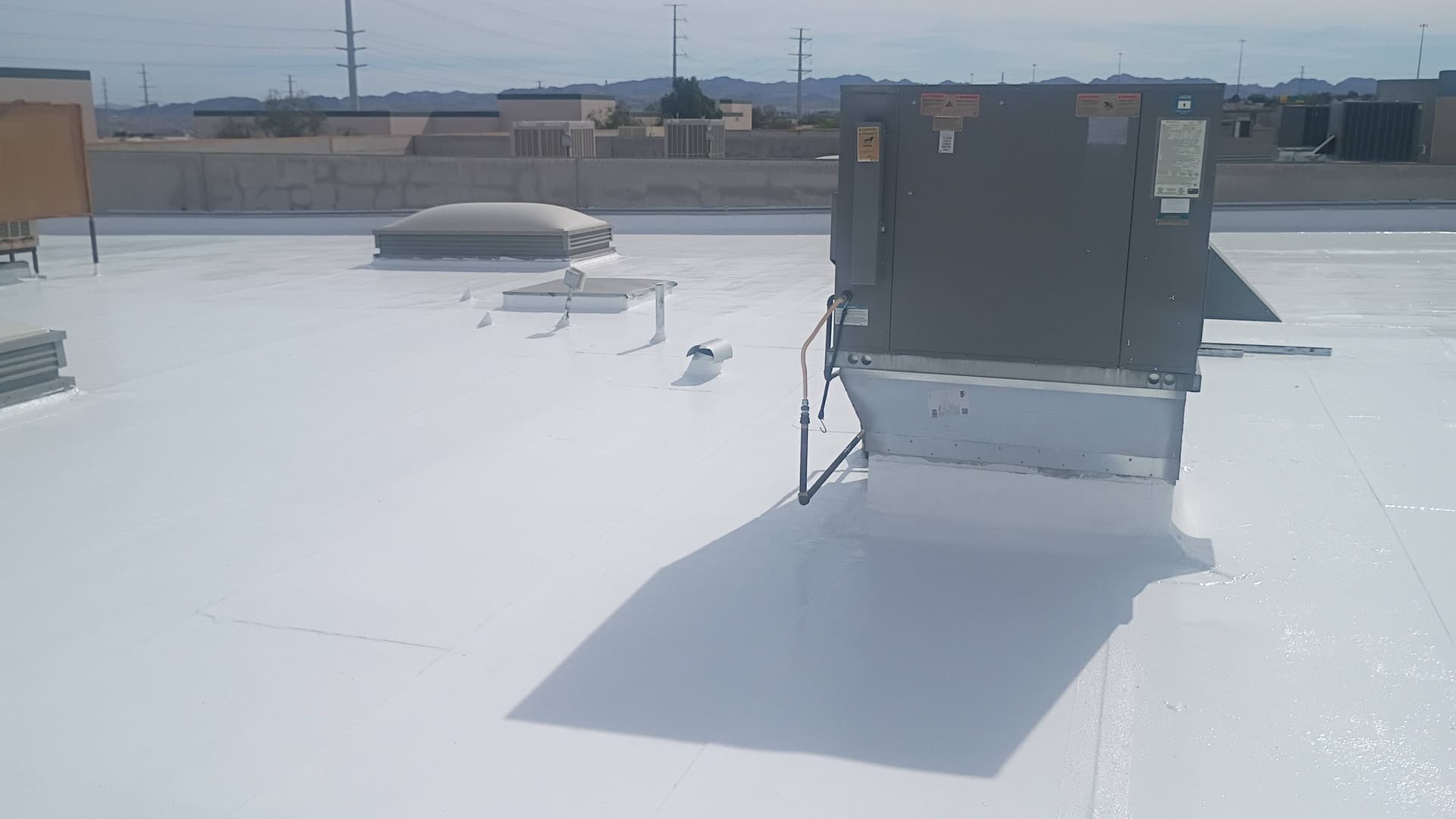 Flat Roof Coating with Silicone Elastomeric in Action