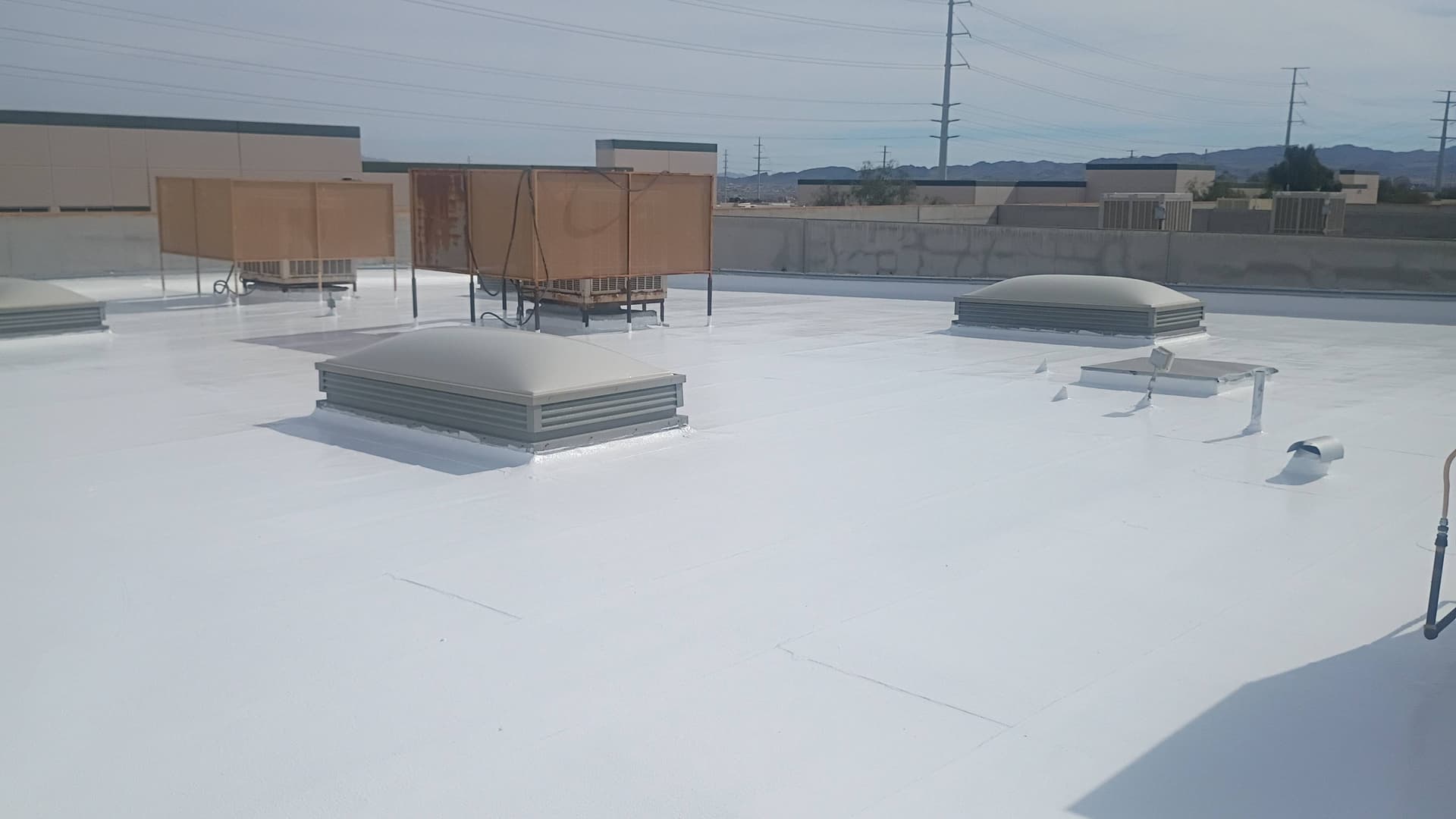 Flat Roof Coating with Silicone Elastomeric in Action