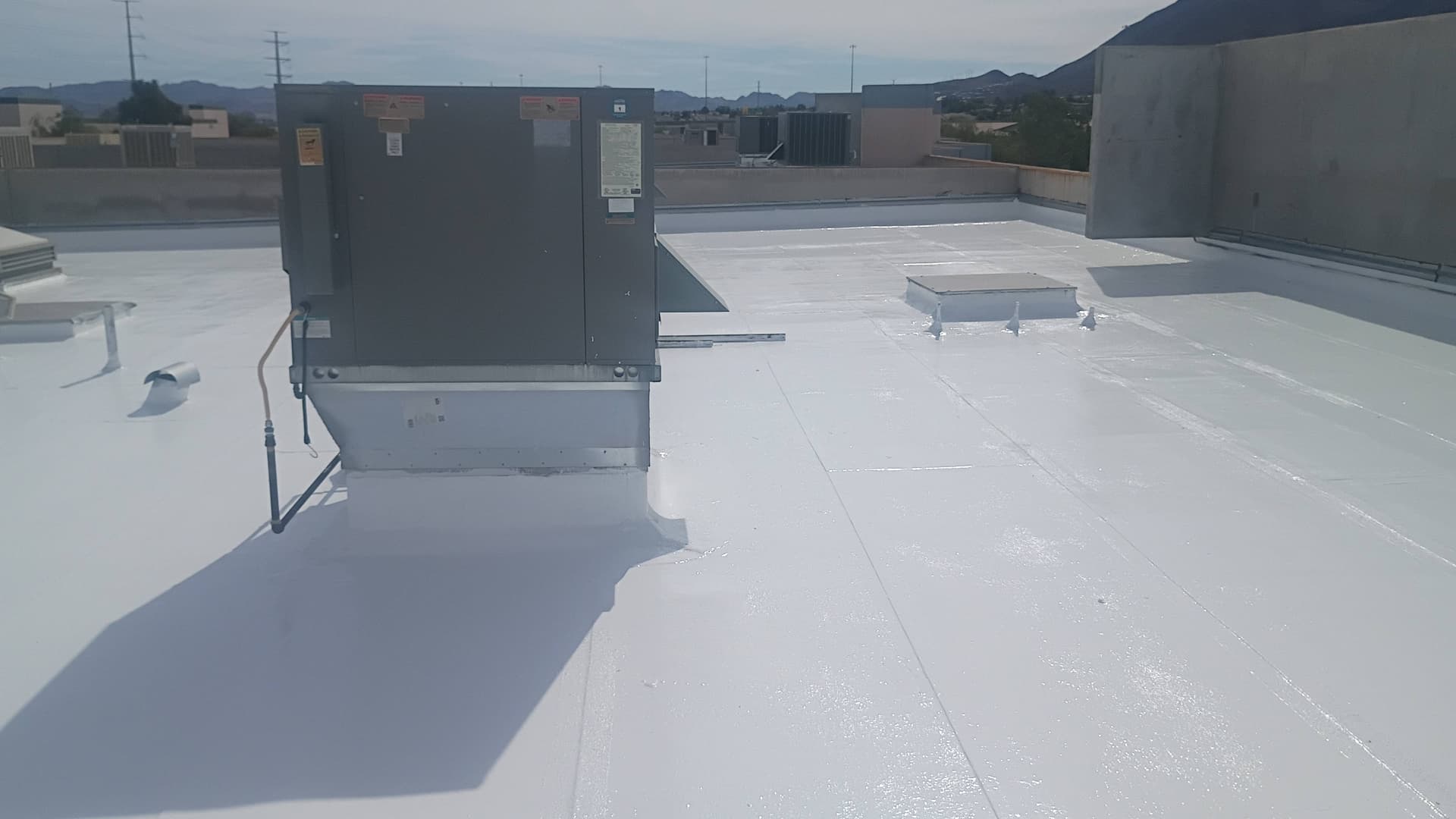Flat Roof Coating with Silicone Elastomeric in Action